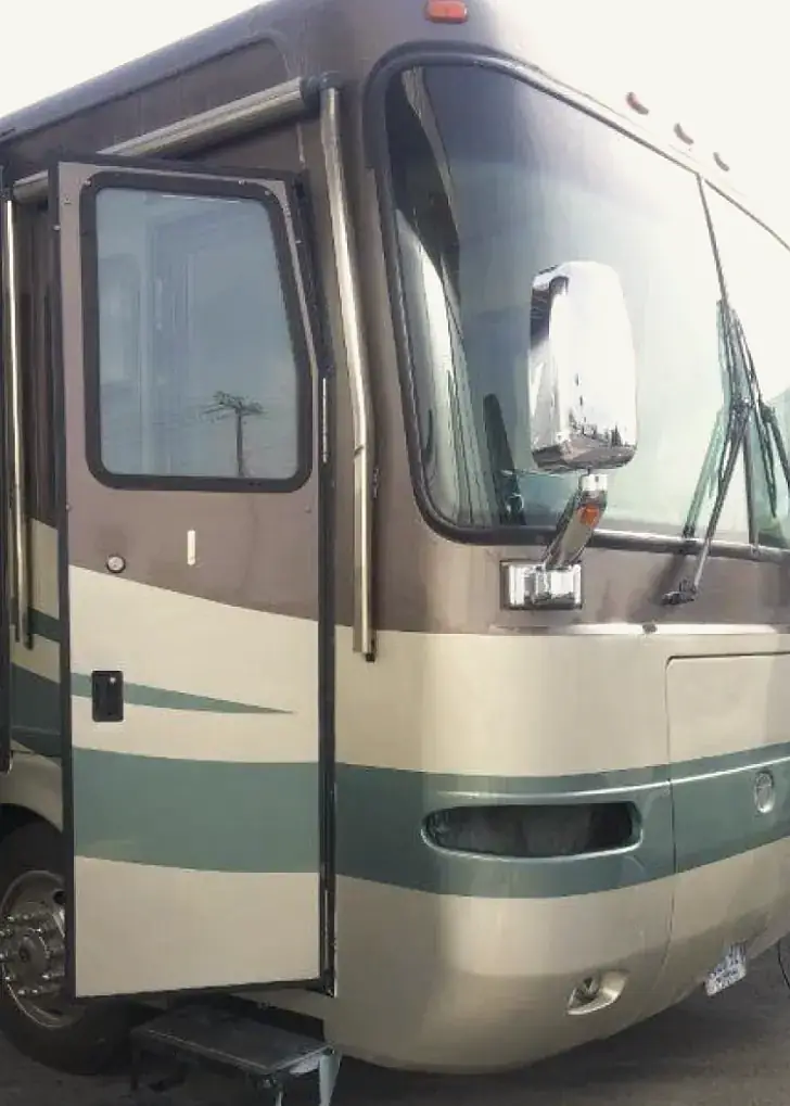 The same motorhome side painted and finished, stripes restored