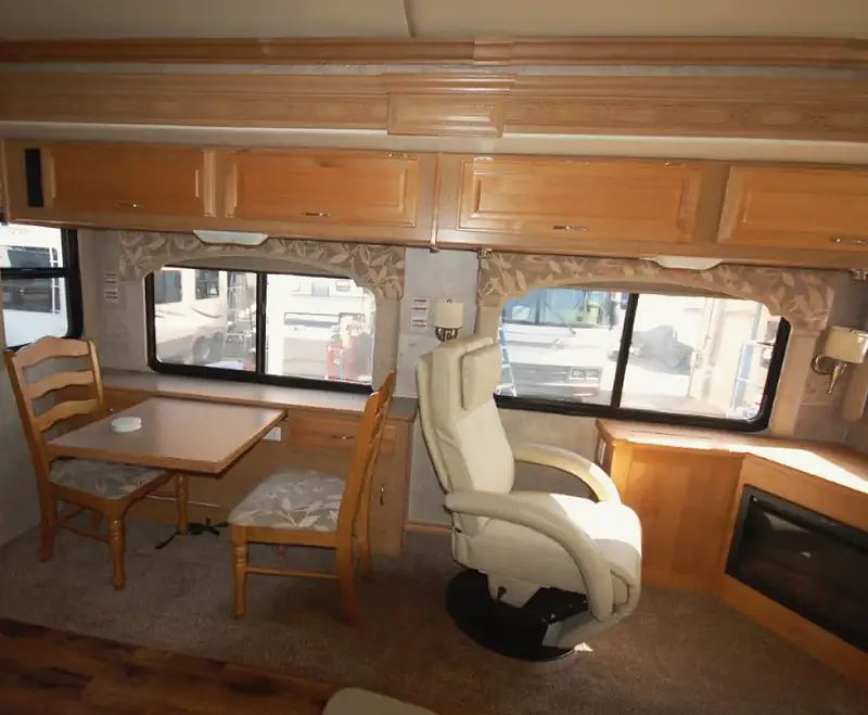 Motorhome living area with a new dinette and recliner