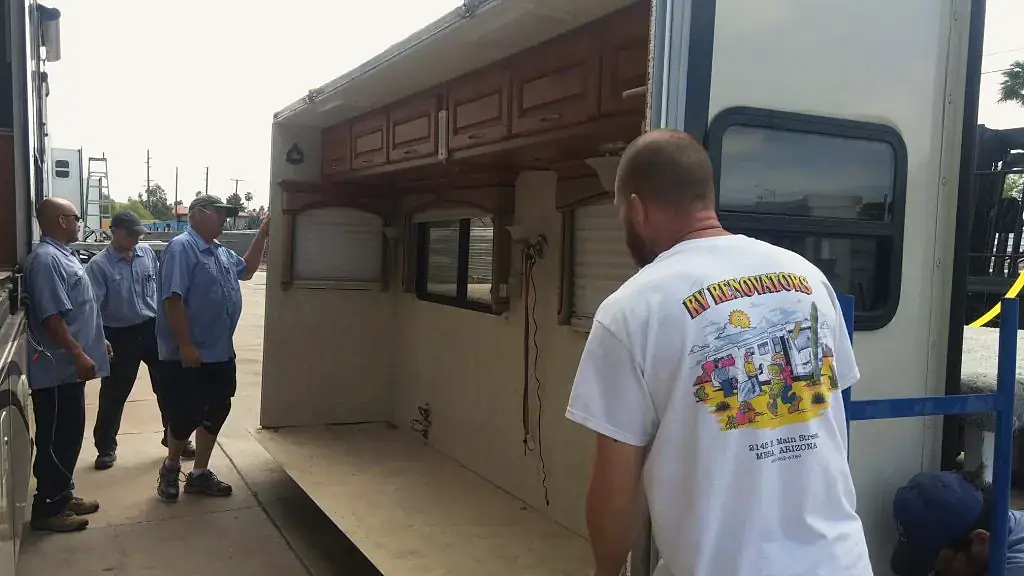 The RV Renovators team rebuilding the rear wall of a fifth wheel in their Mesa yard